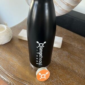 NWOT Orangetheory black metal bottle and phone pop with splat.